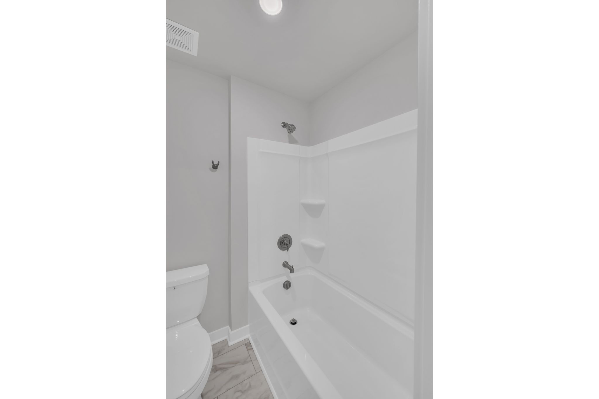 1300 Branch Street Lebanon, TN 37087 - Photo 32 of 43 a bathroom with a tub shower sink and a toilet