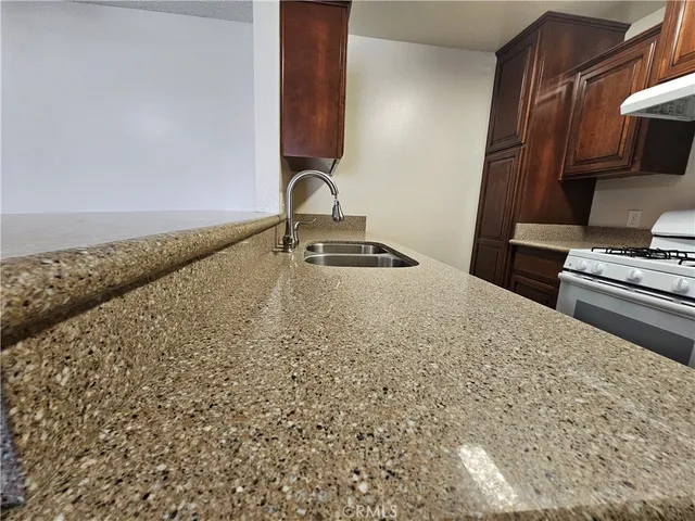 a bedroom with a bed and a stove