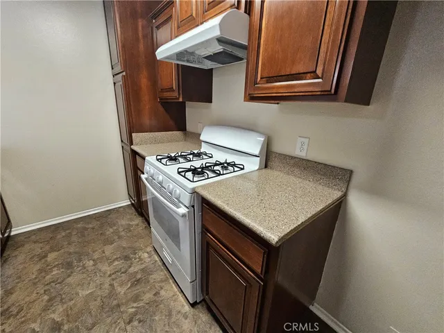 a kitchen with a stove and a microwave
