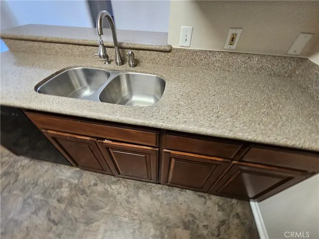 a white toilet sitting next to a bathroom sink