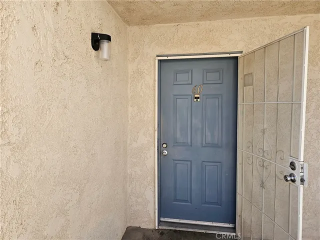 a view of a bathroom with wooden door