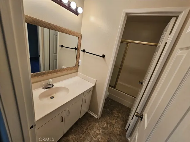 a kitchen with stainless steel appliances granite countertop a refrigerator stove and sink