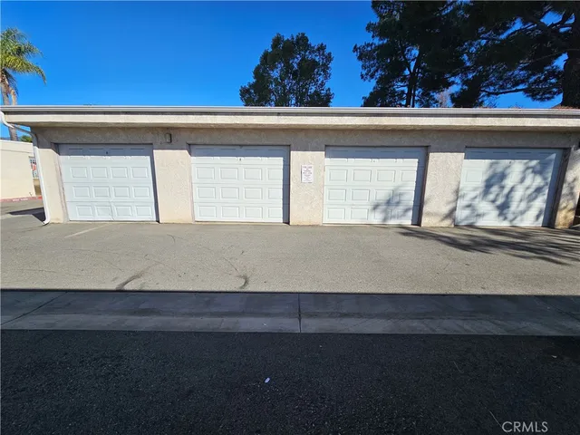 a view of a cars park on the side of a street