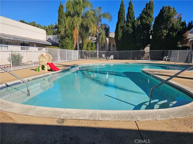 a view of a backyard with table and chairs