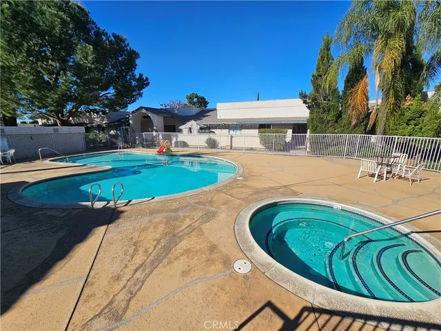 a view of a swimming pool with a patio