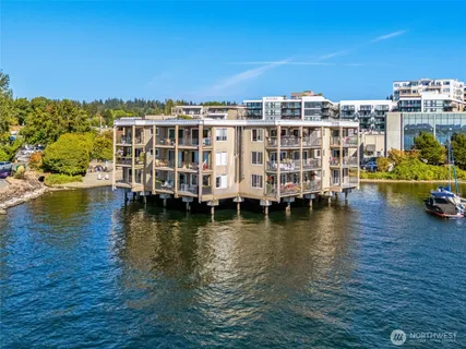 a view of residential building with swimming pool and lake view