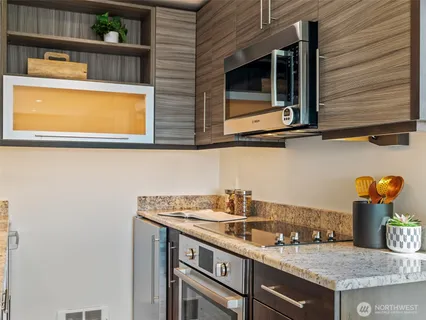 a kitchen with a sink and cabinets
