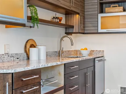 a kitchen with a sink a counter space and a window