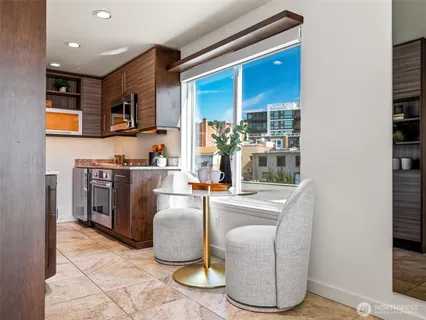 a kitchen with a sink cabinets and appliances