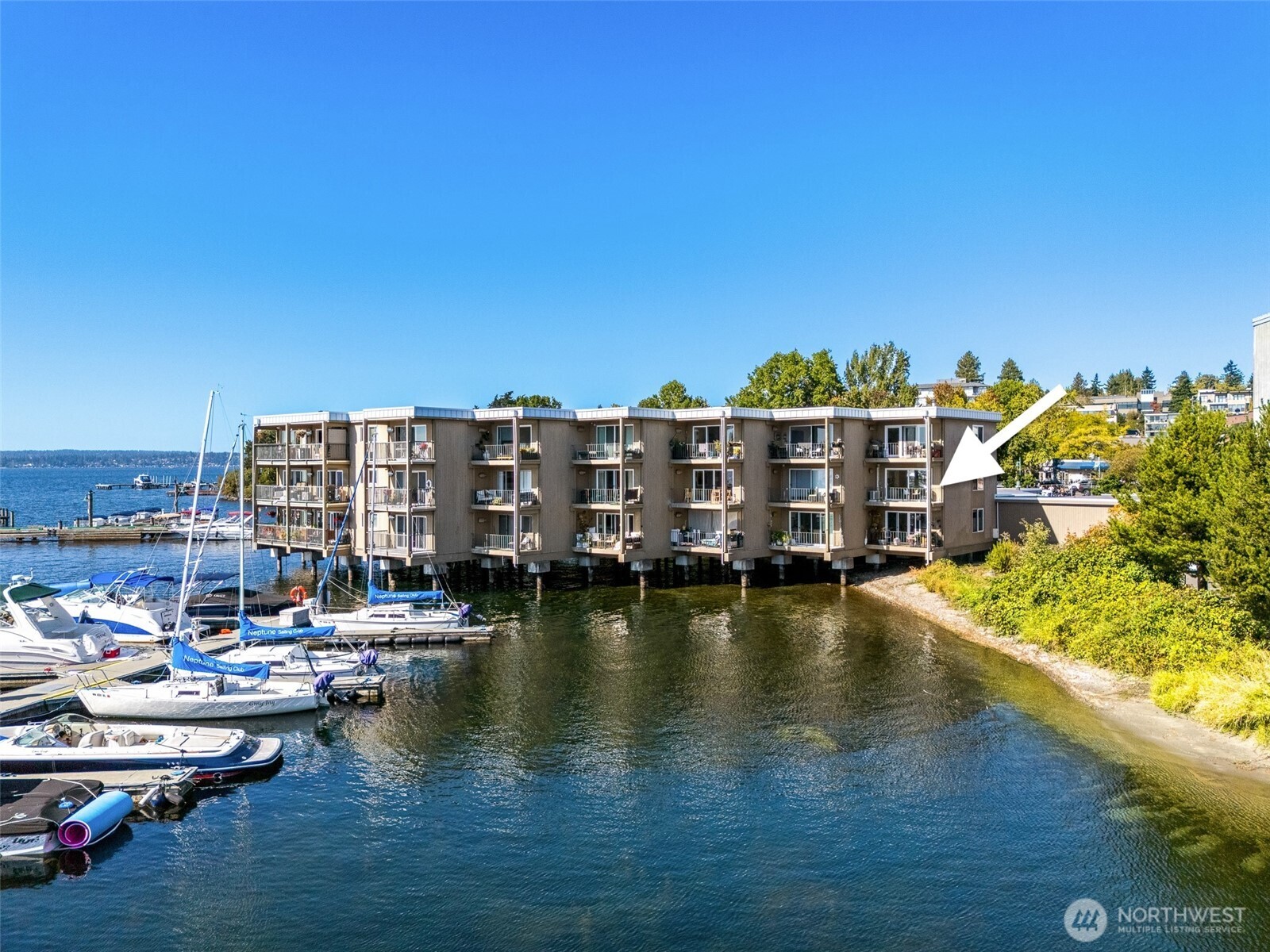 65 Kirkland Avenue, Unit 201 Kirkland, WA 98033 - Photo 2 of 35 a view of ocean with boats and trees in the background