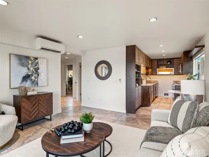a living room with furniture and a table