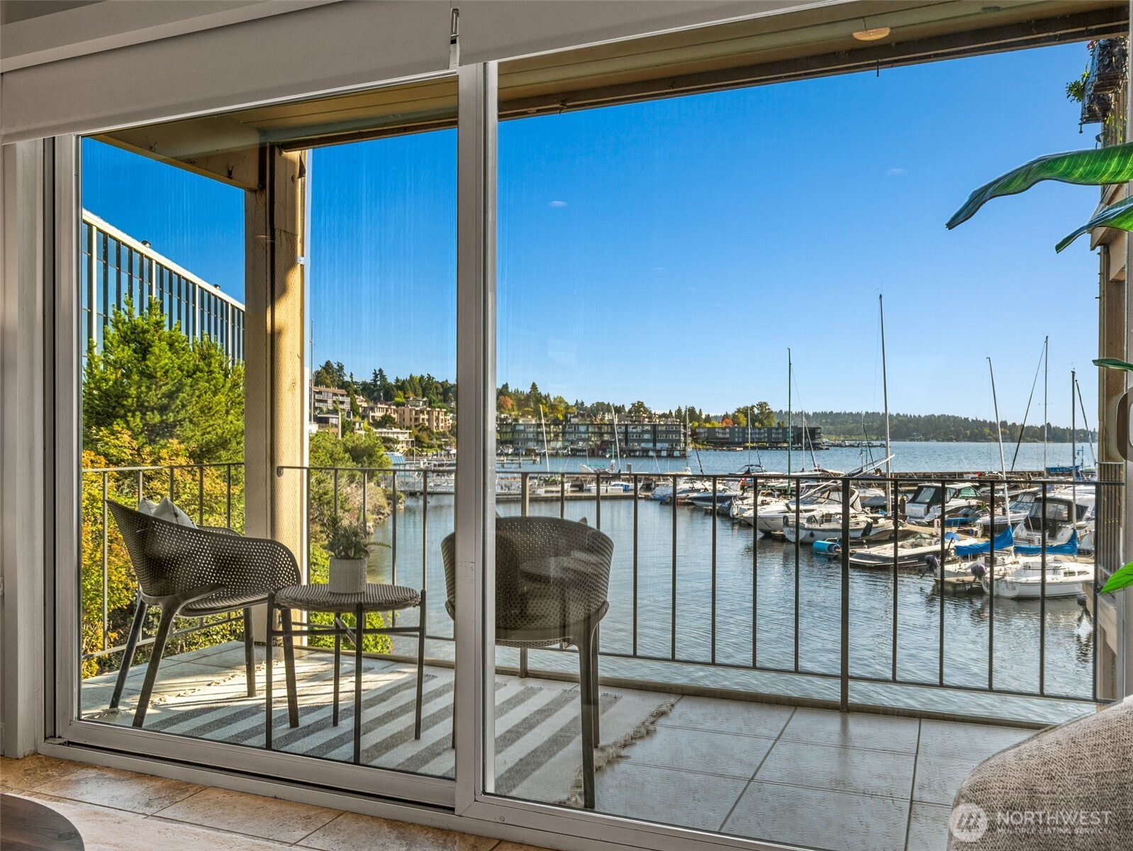 65 Kirkland Avenue, Unit 201 Kirkland, WA 98033 - Photo 25 of 35 a balcony with table and chairs