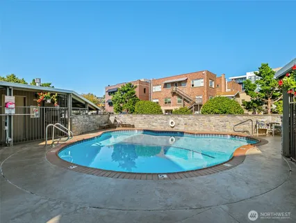 a view of a swimming pool with a patio