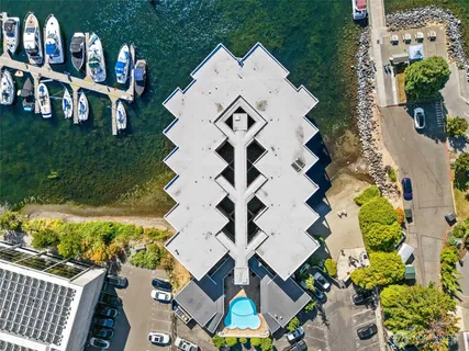 an aerial view of multiple houses with yard