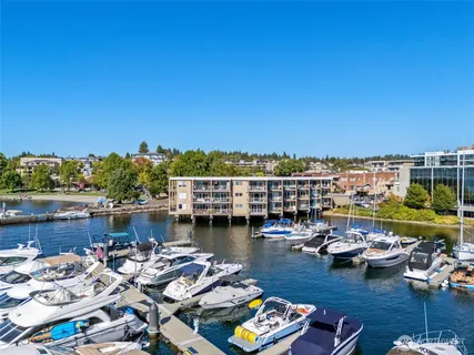 a view of a lake with boats and trees
