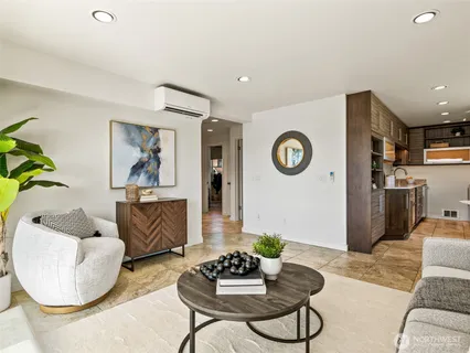 a living room with furniture and a table