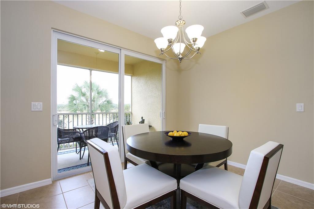 8540 Violeta Street, Unit 202 Estero, FL 34135 - Photo 11 of 22 a view of a dining room with furniture window and outside view