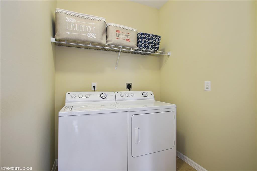 8540 Violeta Street, Unit 202 Estero, FL 34135 - Photo 18 of 22 a utility room with dryer and washer