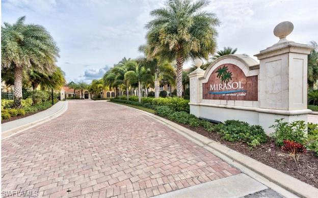 8540 Violeta Street, Unit 202 Estero, FL 34135 - Photo 21 of 22 a view of a sign board with buildings in the background