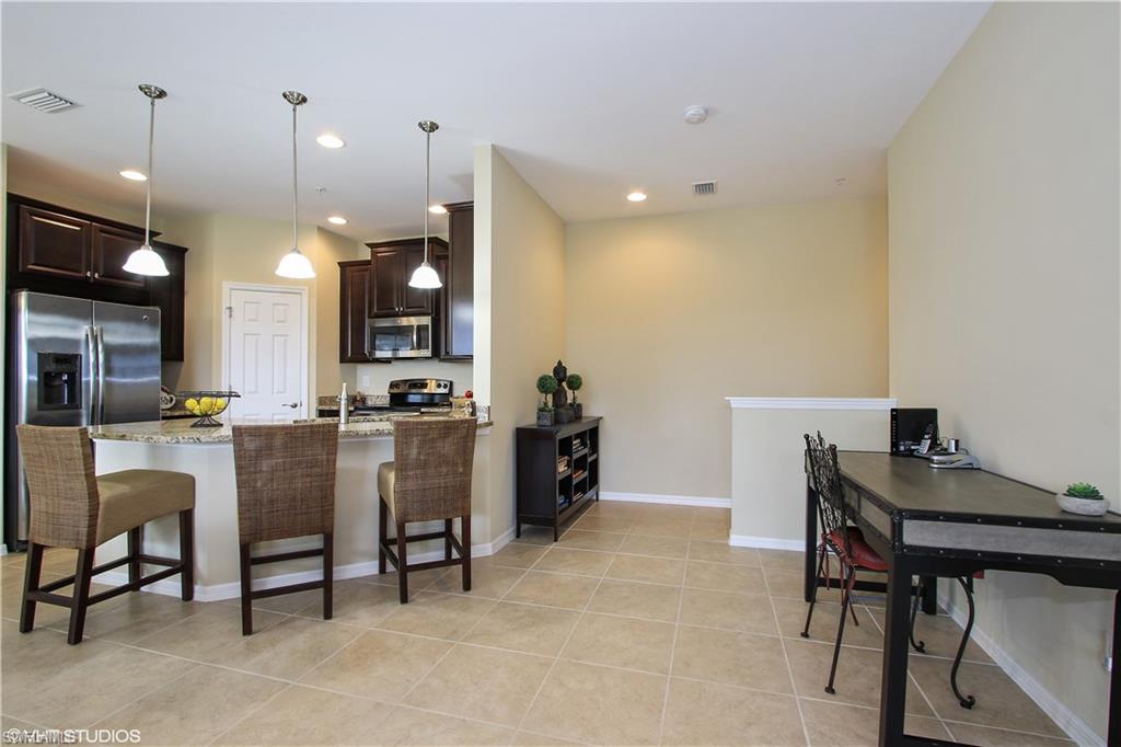 8540 Violeta Street, Unit 202 Estero, FL 34135 - Photo 3 of 22 a view of a dining room with furniture