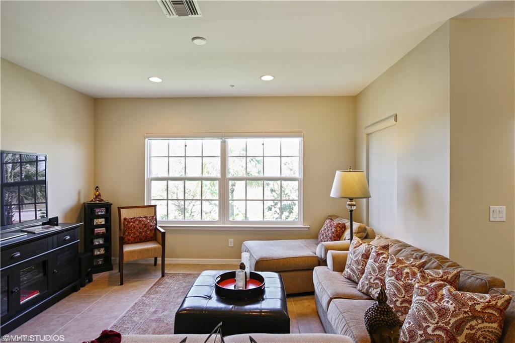 8540 Violeta Street, Unit 202 Estero, FL 34135 - Photo 5 of 22 a living room with furniture and a window