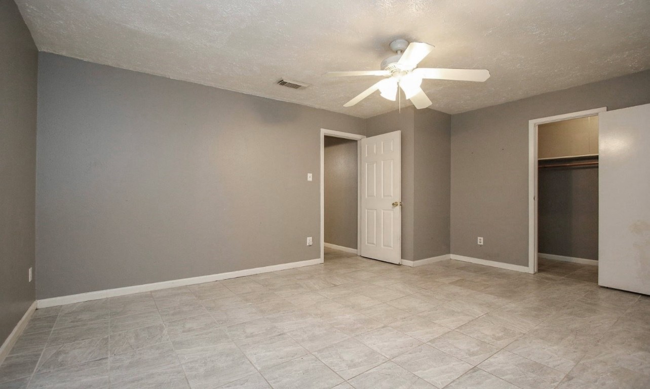 3111 Oak Rock Spring, TX 77373 - Photo 18 of 21 an empty room with fan and entryway