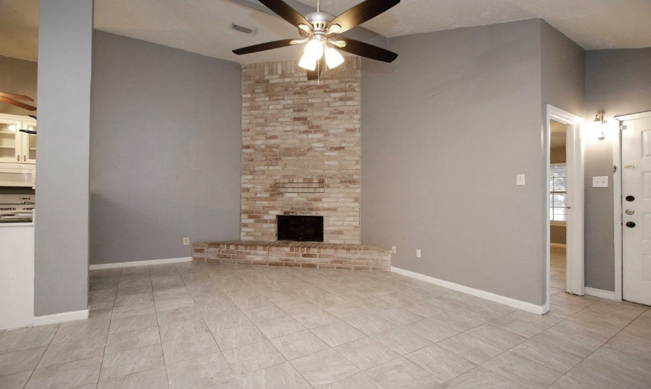 3111 Oak Rock Spring, TX 77373 - Photo 4 of 21 a view of an empty room with a fireplace