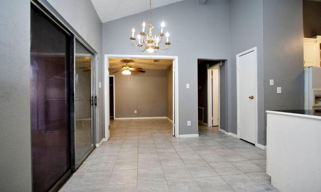 3111 Oak Rock Spring, TX 77373 - Photo 6 of 21 a view of a hallway with chandelier and chandelier