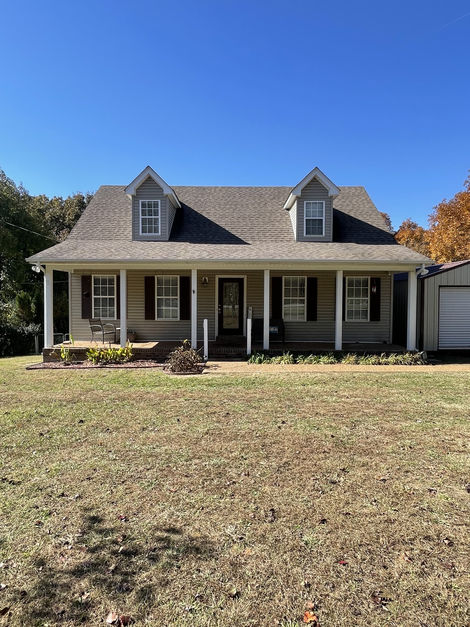 1168 West Grab Creek Road Dickson, TN 37055 - Photo 1 of 37 a front view of a house with a garden