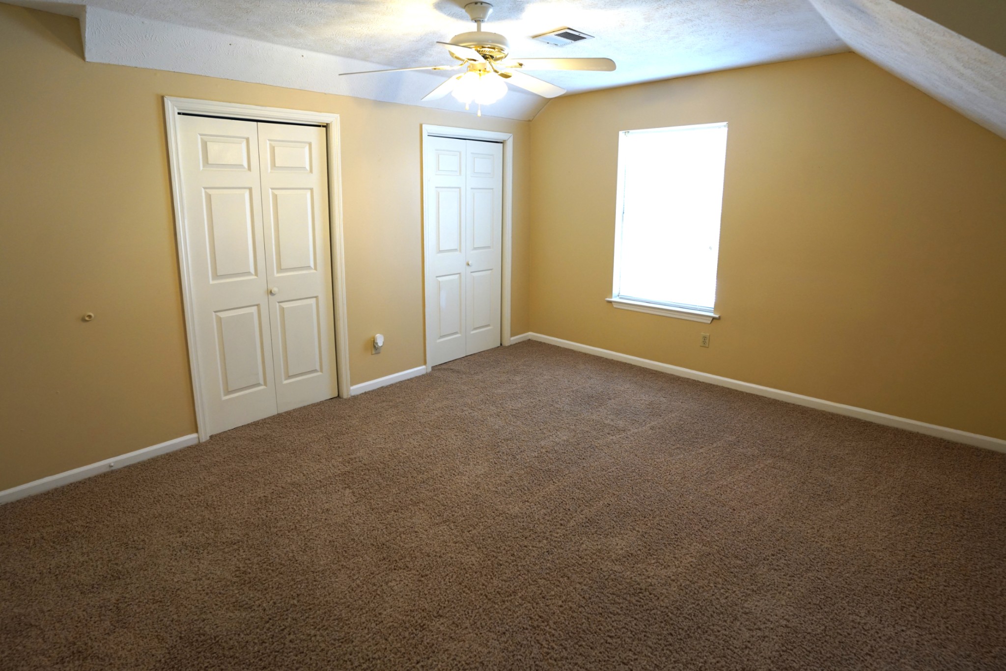 1168 West Grab Creek Road Dickson, TN 37055 - Photo 23 of 37 an empty room with windows and chandelier fan
