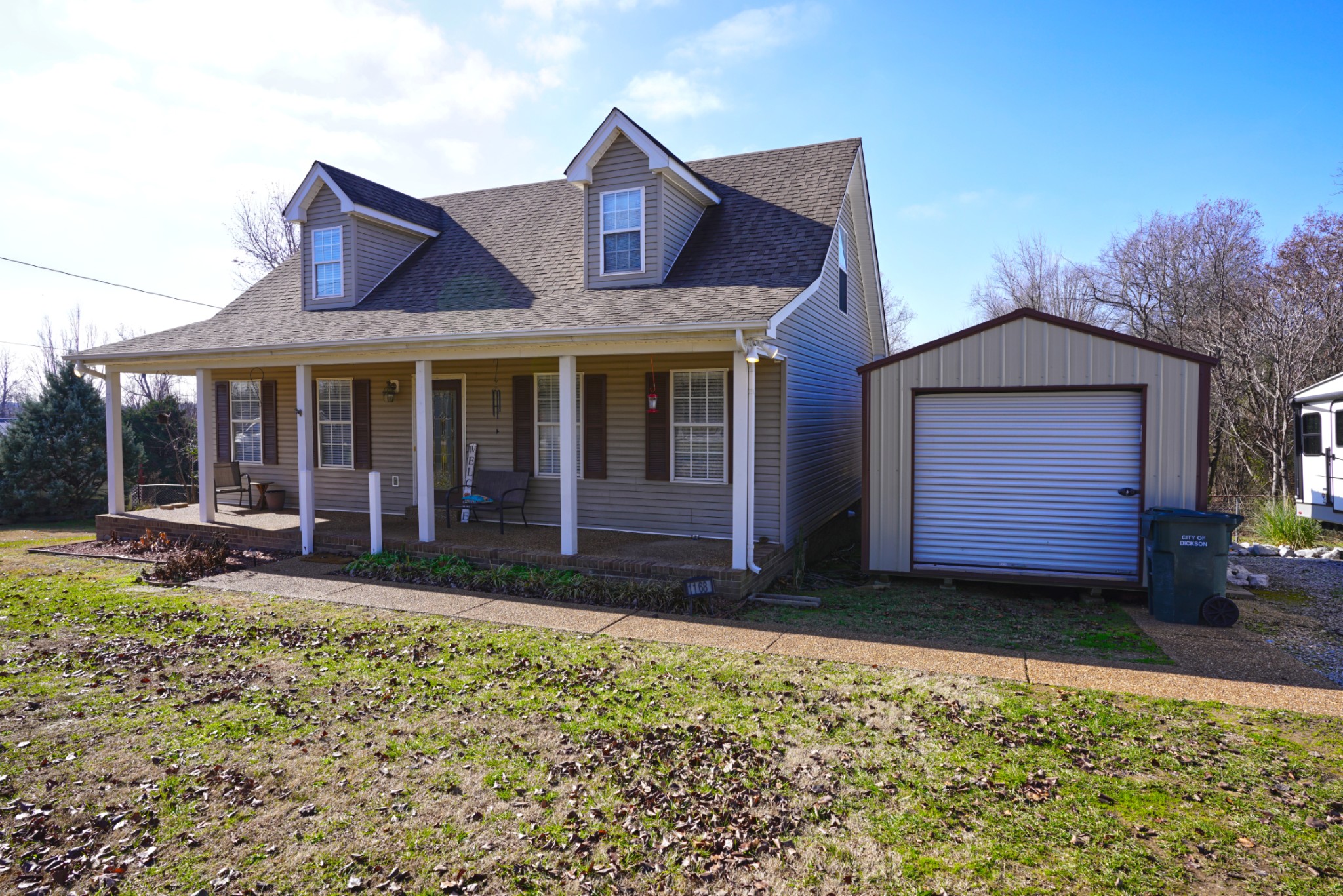 1168 West Grab Creek Road Dickson, TN 37055 - Photo 3 of 37 a view of a house with a yard and large tree