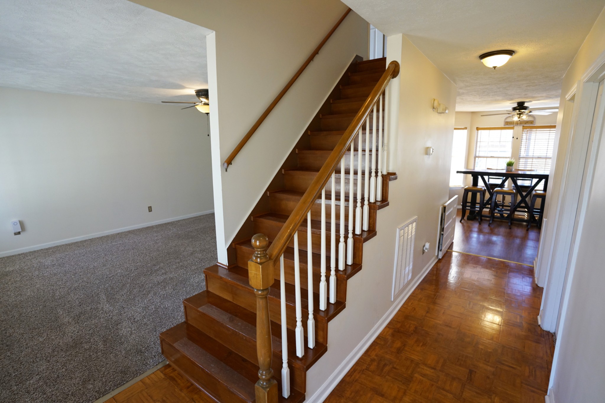 1168 West Grab Creek Road Dickson, TN 37055 - Photo 6 of 37 wooden floor with a dining room with wooden floor and stairs