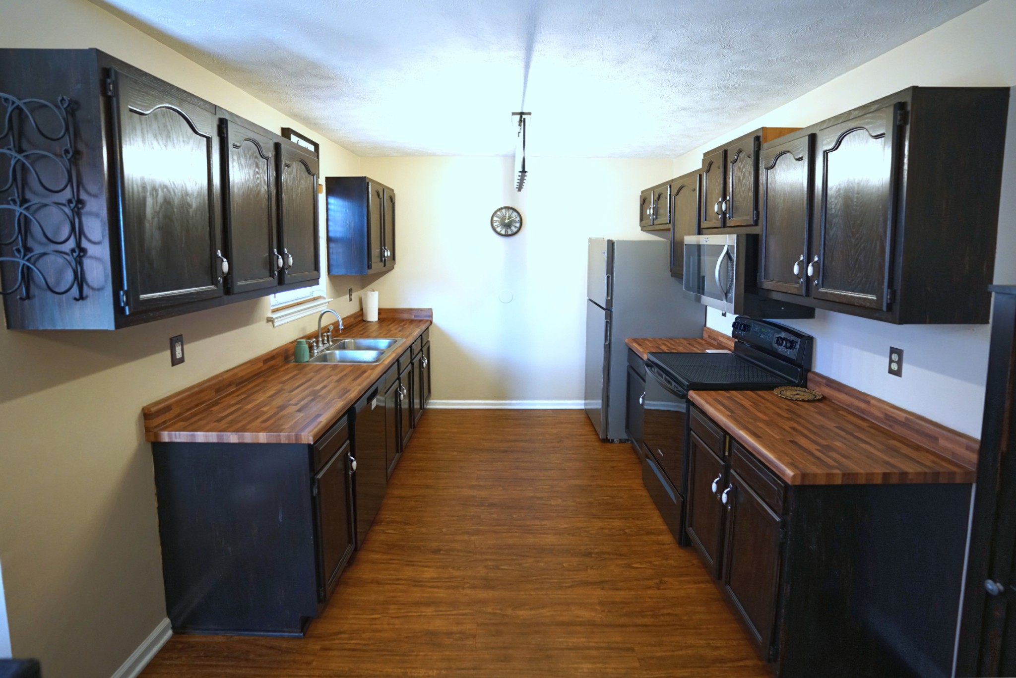 1168 West Grab Creek Road Dickson, TN 37055 - Photo 10 of 37 a kitchen with stainless steel appliances granite countertop wooden cabinets a refrigerator and a stove