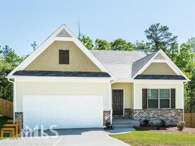 6030 Heisler Street Rex, GA 30273 - Photo 1 of 1 a front view of a house with a yard