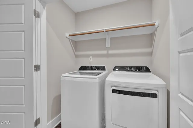 a bathroom with a granite countertop sink a toilet mirror vanity and bathtub