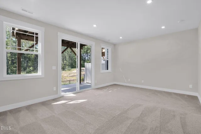 a bathroom with a toilet a sink and a mirror