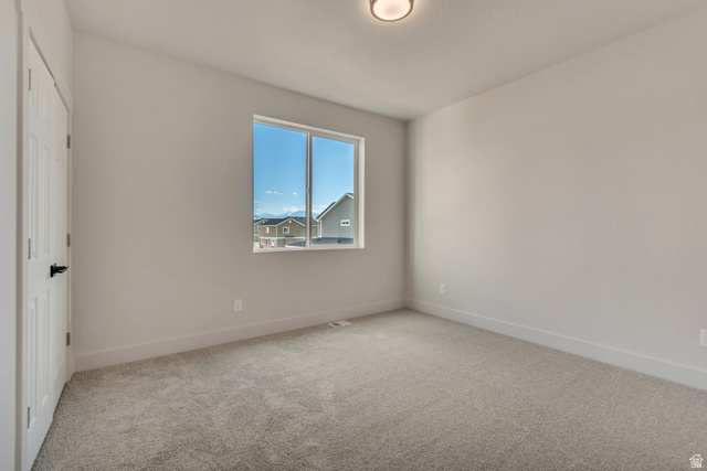 2535 West Santa Fe Drive Mapleton, UT 84664 - Photo 16 of 26 Unfurnished bedroom featuring light carpet and baseboards