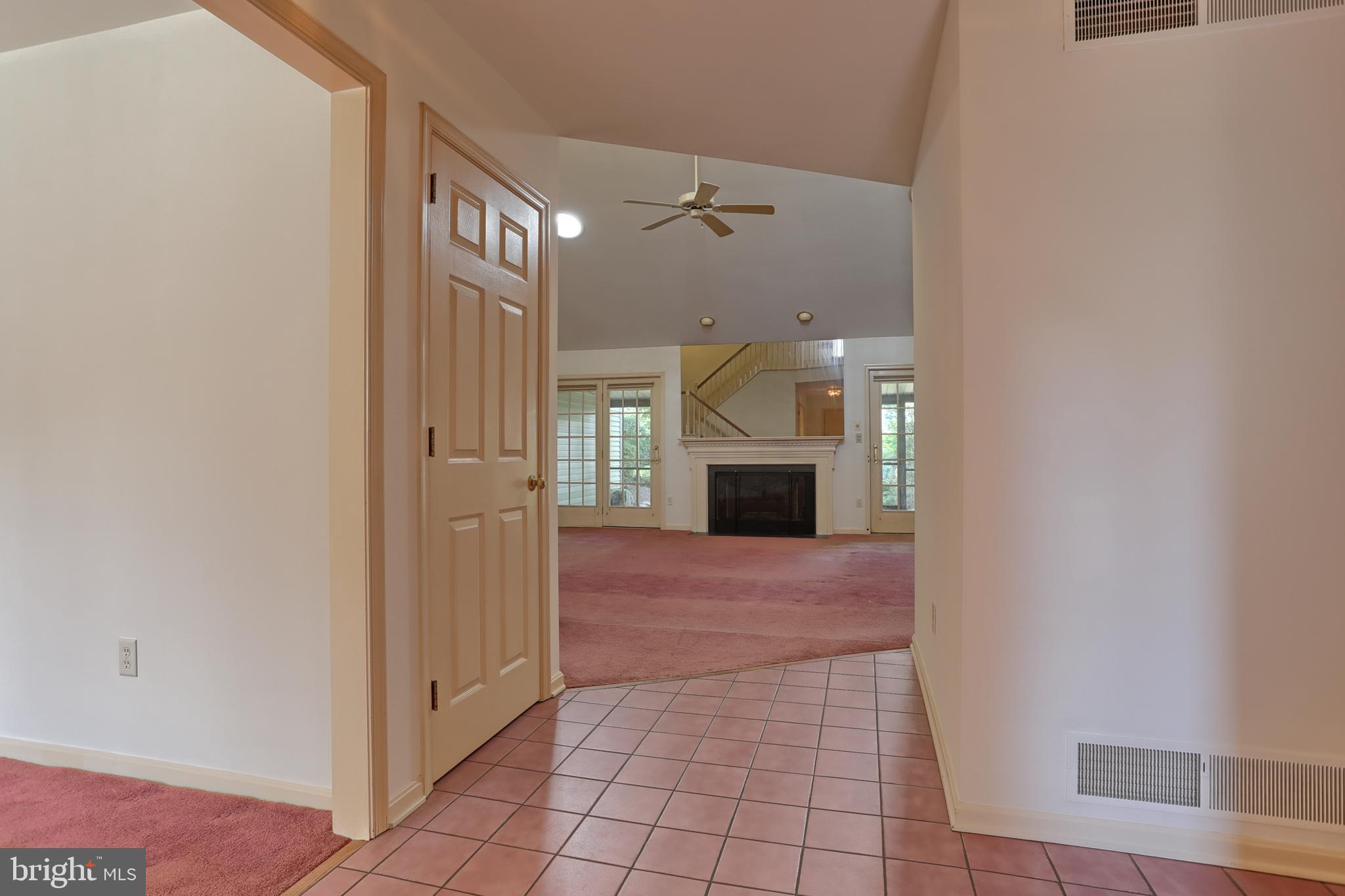 Massive foyer leading to den, kitchen, living room