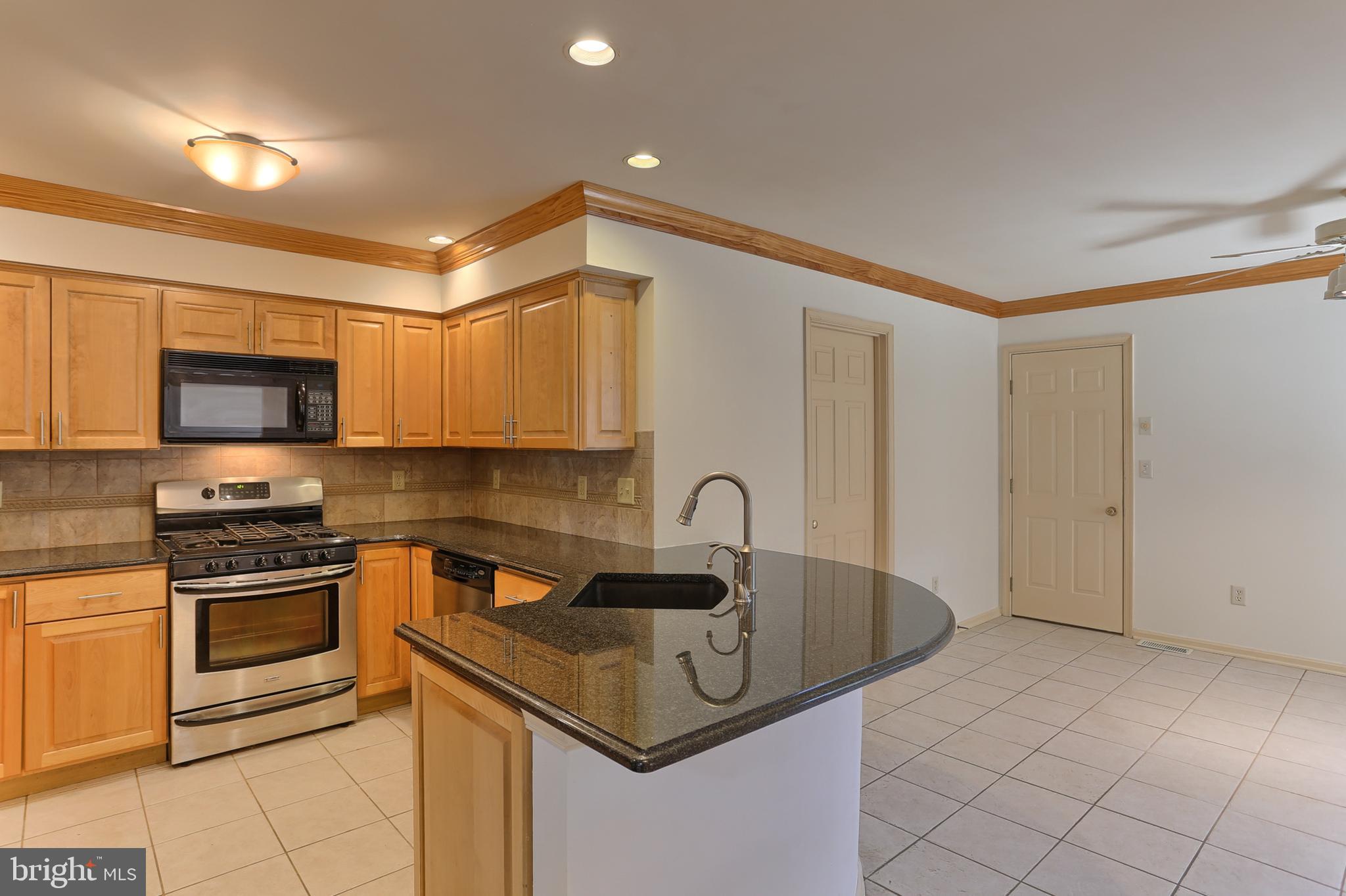77 Cambridge Drive Hershey, PA 17033 - Photo 9 of 33 Very large dining area; laundry room to left side