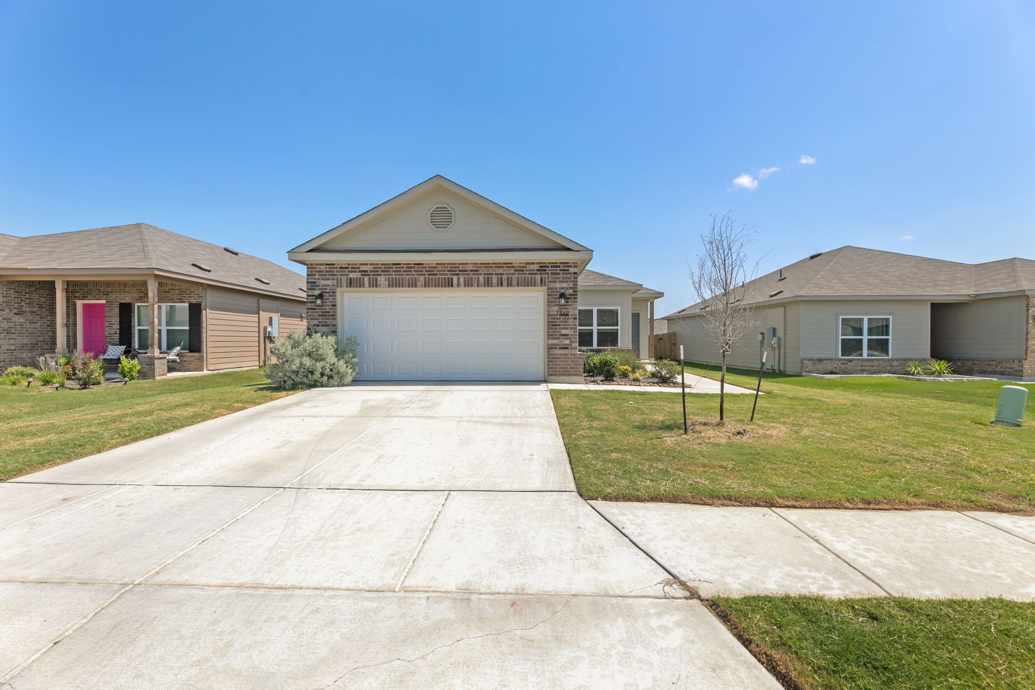 a front view of a house with a yard