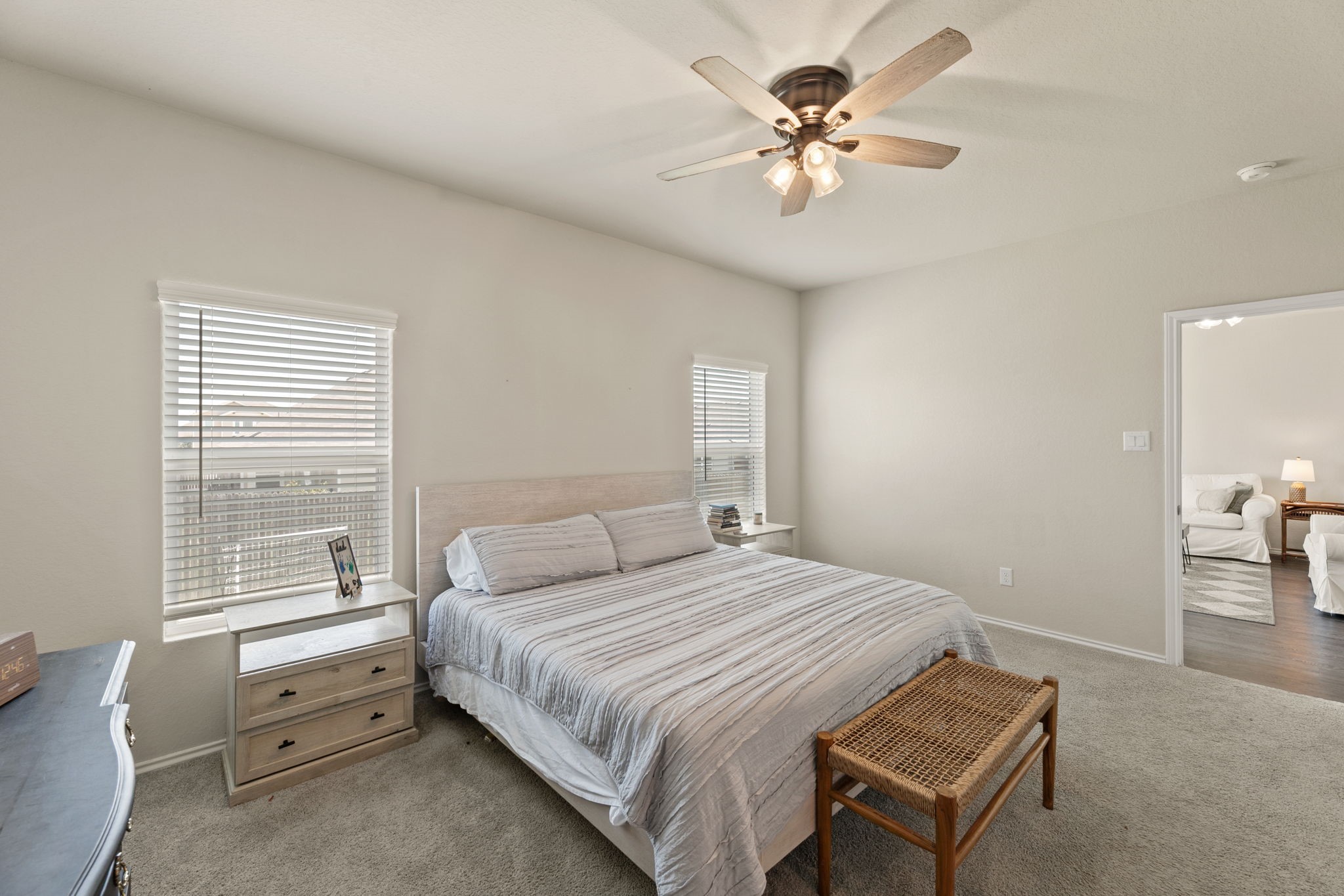3969 Legend Ranch New Braunfels, TX 78130 - Photo 17 of 32 a bedroom with a bed and a chandelier