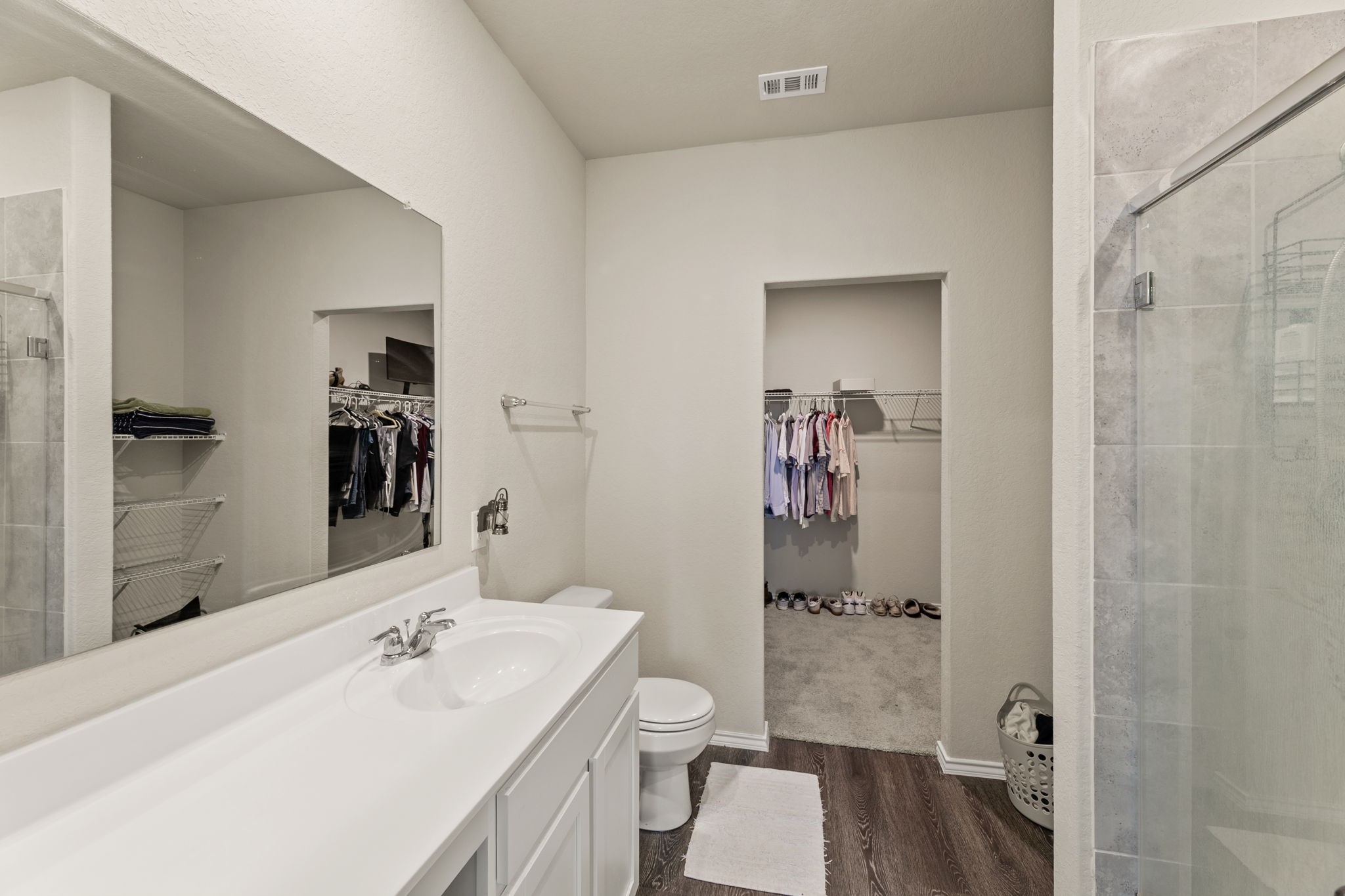 3969 Legend Ranch New Braunfels, TX 78130 - Photo 19 of 32 a bathroom with a sink a toilet and shower