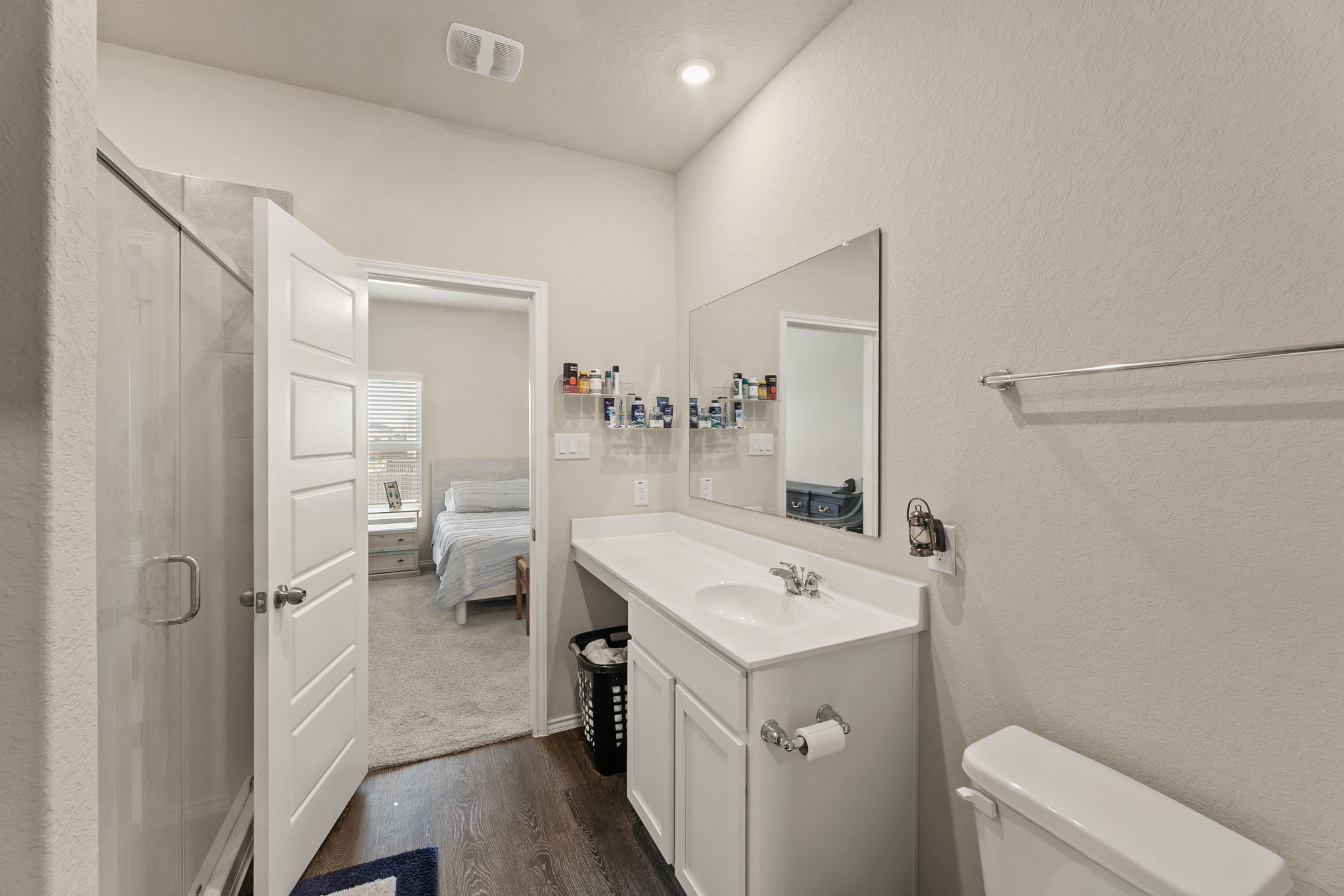 3969 Legend Ranch New Braunfels, TX 78130 - Photo 20 of 32 a view of a bathroom with a sink mirror and toilet