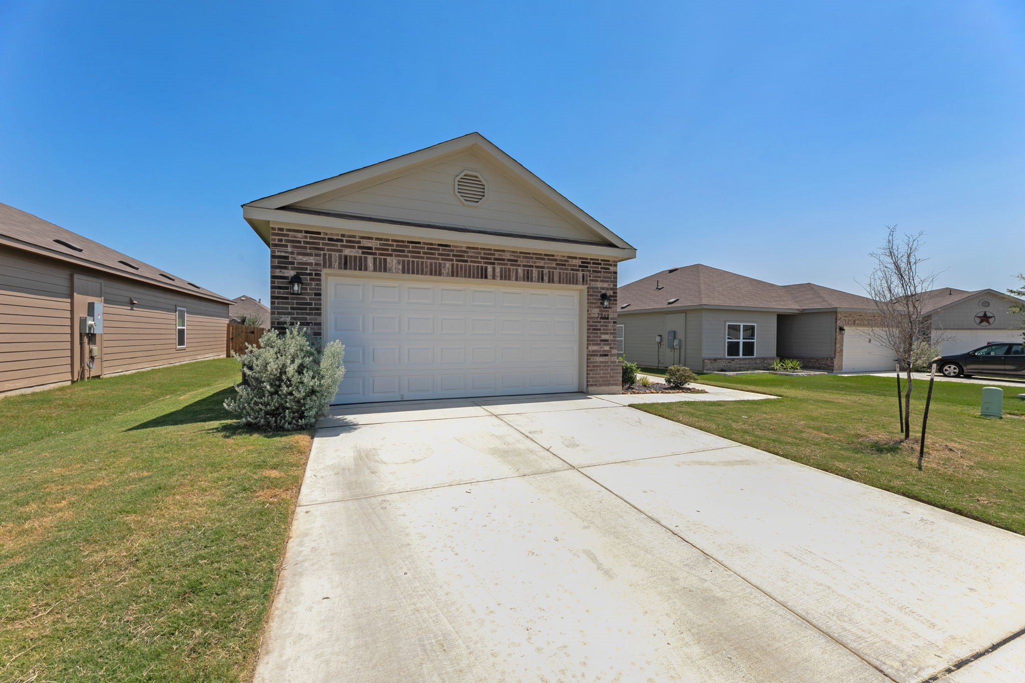 3969 Legend Ranch New Braunfels, TX 78130 - Photo 2 of 32 a front view of a house with a yard