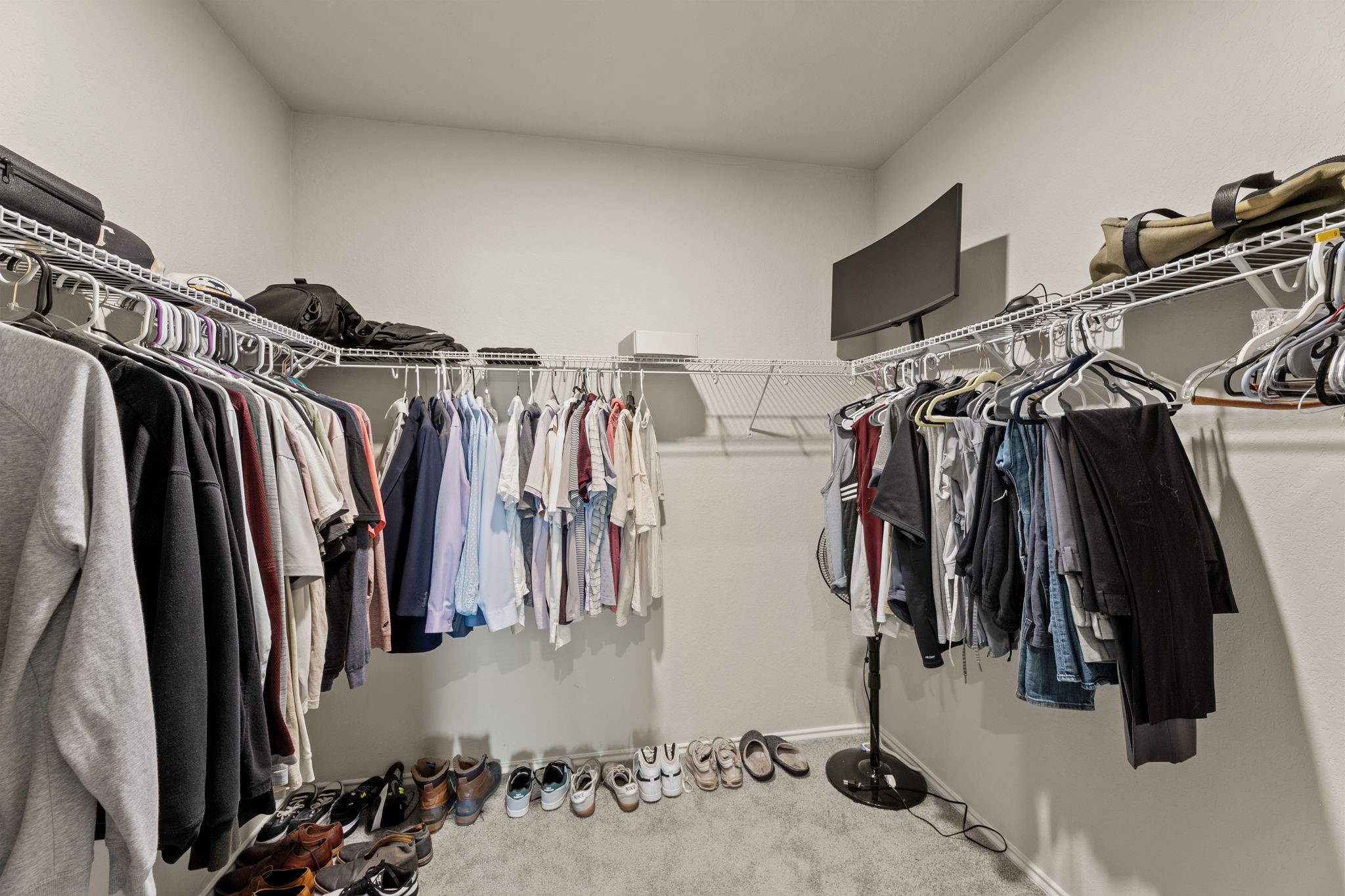 3969 Legend Ranch New Braunfels, TX 78130 - Photo 22 of 32 a view of walk in closet with clothes and shoes