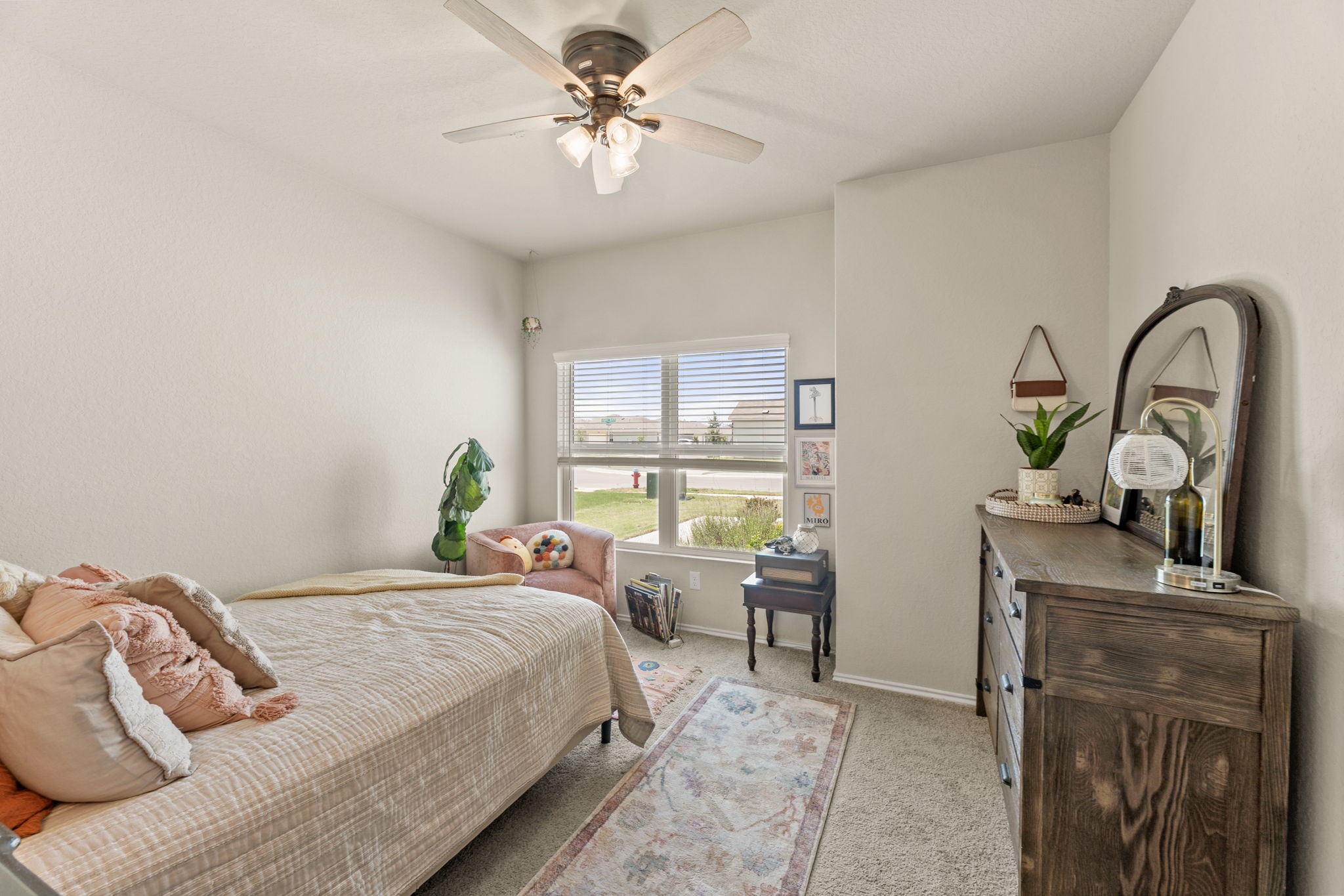 3969 Legend Ranch New Braunfels, TX 78130 - Photo 23 of 32 a bedroom with a bed and a table with the outer view