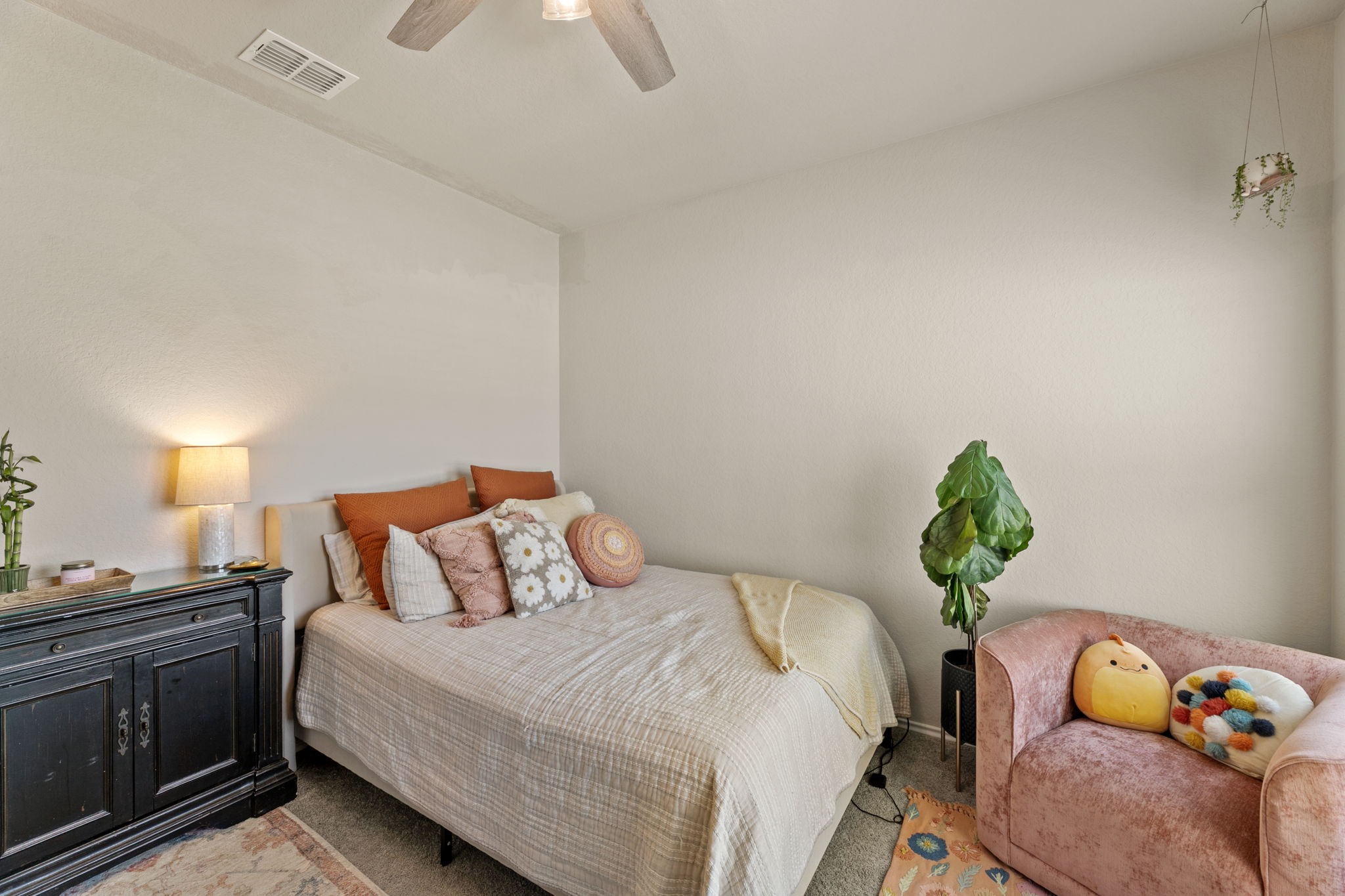 3969 Legend Ranch New Braunfels, TX 78130 - Photo 24 of 32 a bedroom with a bed and ceiling fan