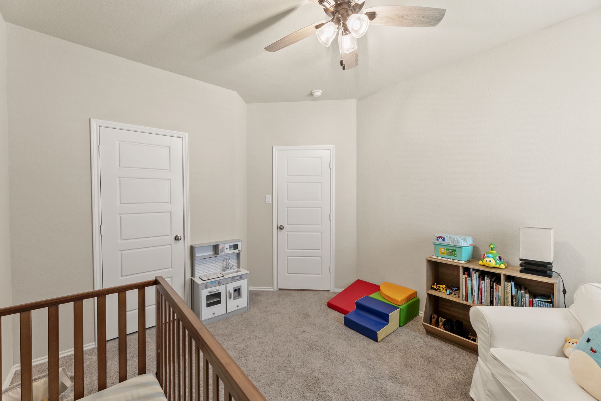 3969 Legend Ranch New Braunfels, TX 78130 - Photo 29 of 32 a bedroom with furniture and a book shelf