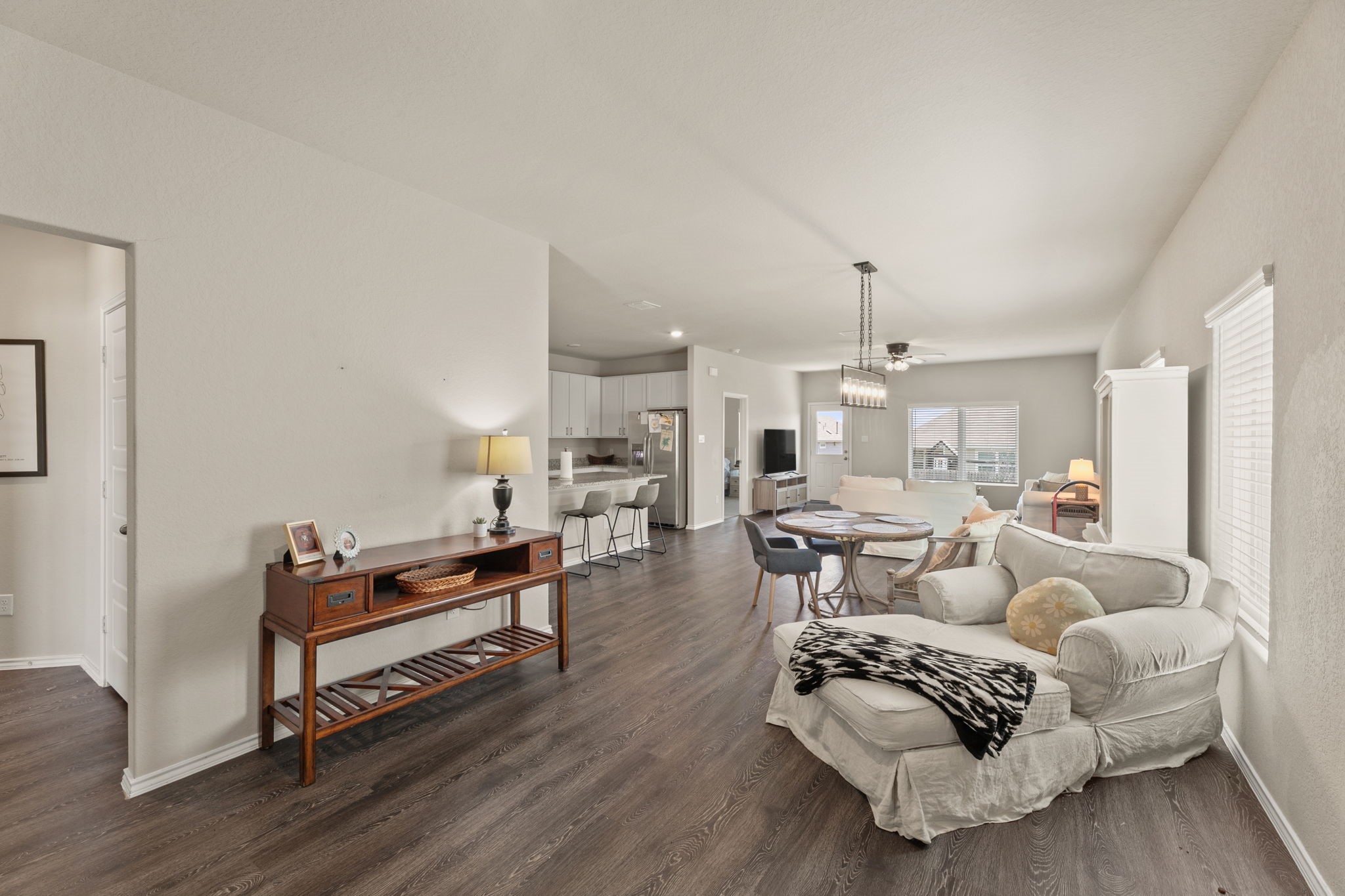 3969 Legend Ranch New Braunfels, TX 78130 - Photo 4 of 32 a living room with furniture a rug and white walls
