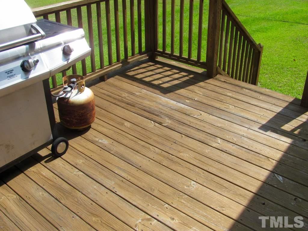 1175 Silas Moore Road Benson, NC 27504 - Photo 14 of 18 a view of a wooden floor with a bench